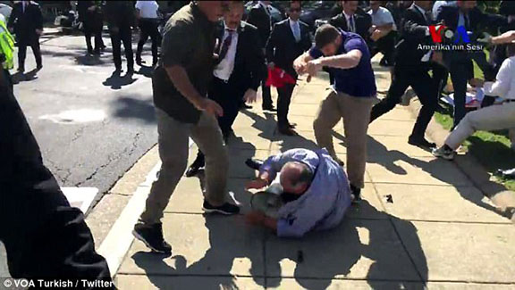 Erdogan supporters beat a protester last week in front of the Turkish Ambassador's residence in DC