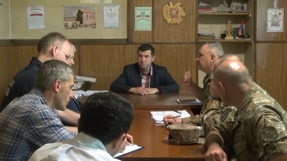 OSCE monitors at a briefing with Armenian Defense Ministry officials