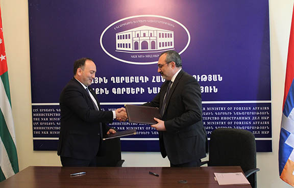 Abkhazia Foreign Minister Daur Kove (left) with his Artsakh counterpart Karen Mirzoyan after signing a memorandum of understanding