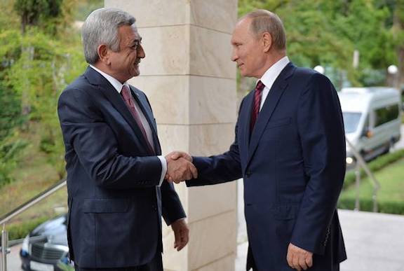 Russian President Vladimir Putin greets Serzh Sarkisian in Sochi on Wednesday