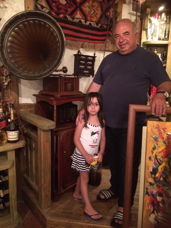 Akhoyan with his granddaughter at his home