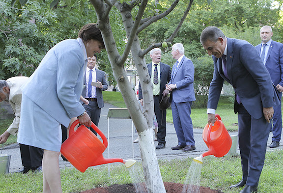 Baroness Cox and Speaker Babloyan water a tree