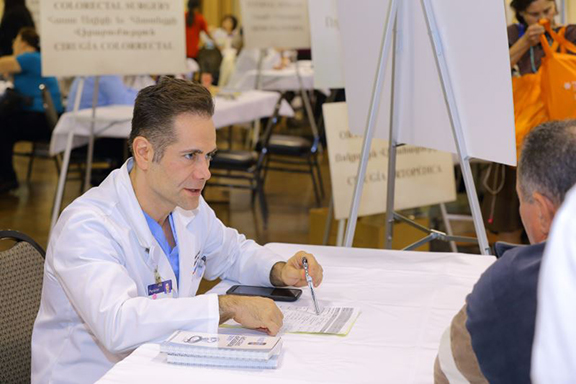 Harry Balian with a patient