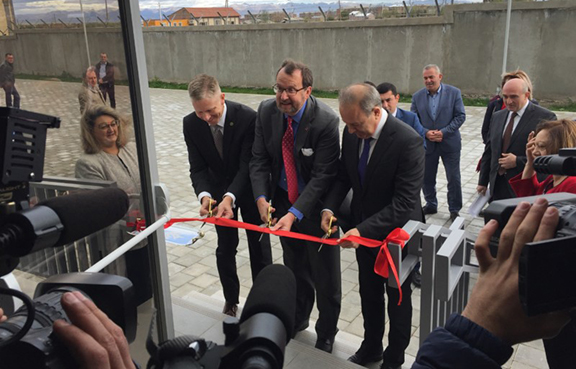 US Ambassador to Armenia Richard Mills cuts the ribbon at a lab in Martuni