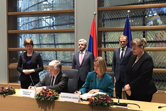 Armenia's Foreign Minister Edward Nalbandian and EU's representative of foreign affairs, Federica Mogherini. sign the comprehensive agreement with President Serzh Sarkisian and the President of the European Council Donald Tusk looking on