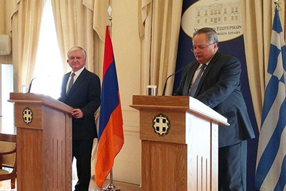 Armenia's Foreign Minister Edward Nalbandian (left) with his Greek counterpart Nikos Kotzias speaks at a press conference in Athens on Wednesday