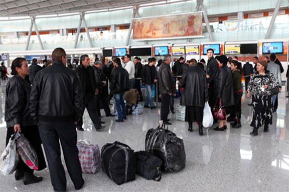 Citizens of Armenia flock to the departure terminal at Zvartnots International Airport in Yerevan