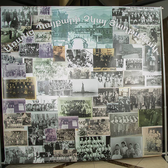 Banner of old DP Photographs with the the heading "Առանց Պայքարի Չկայ Յաղթանակ" which was written on the original DP Camp entrance gate.