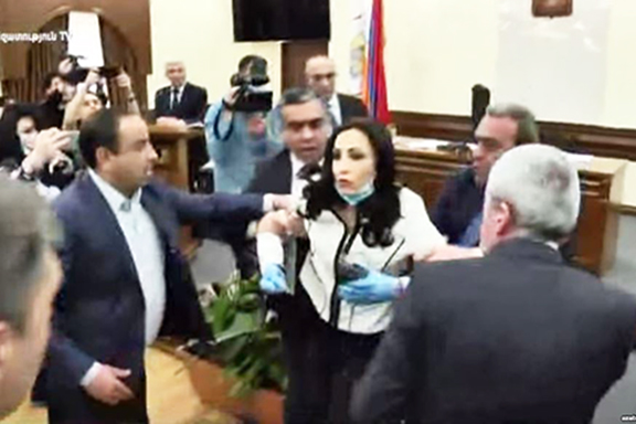 Yerkir Tsirani member Manina Khachatryan is being attacked during a city council meeting (Azatutyun.am)
