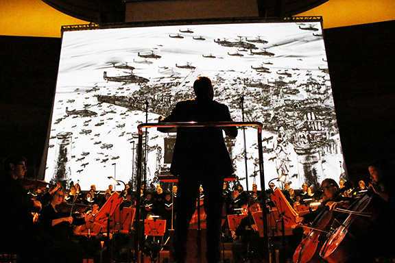 Kevork Mourad's illustrations serve as a backdrop for "Israel in Egypt" at Walt Disney Concert Hall. (Photo by Patrick Brown).