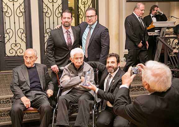 Karpo Dilanian, who during his youth filmed and documented life in the Armenian DP Camp, received the Mesrobian Legacy Award. First Row from l to r: Kirk Felikian, Montebello City Councilmember Jack Hadjinian (Mesrobian Class of 1996). Second Row from l to r: Karpo Felikian; Karpo Dilanian, and Principal Ghoogasian