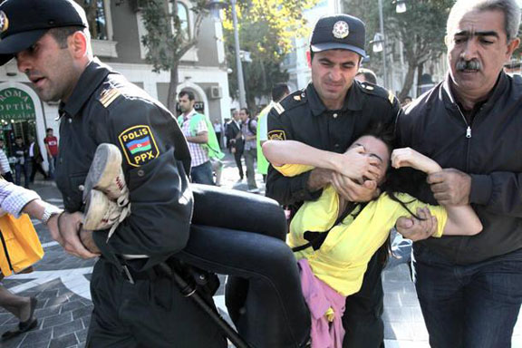 Azerbaijani police detain an opposition activist during a protest rally in Baku, Azerbaijan on Oct. 20, 2012. (Associated Press Photo)
