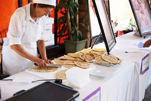 A woman makes the traditional jingalov hats at last year's "Discover Shushi" event