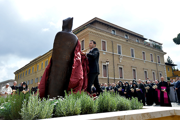 Armenia's Ambassador to the Vatican Mikael Minasyan unveils the stature of St, Gregory of Narek in the Vatican Gardens