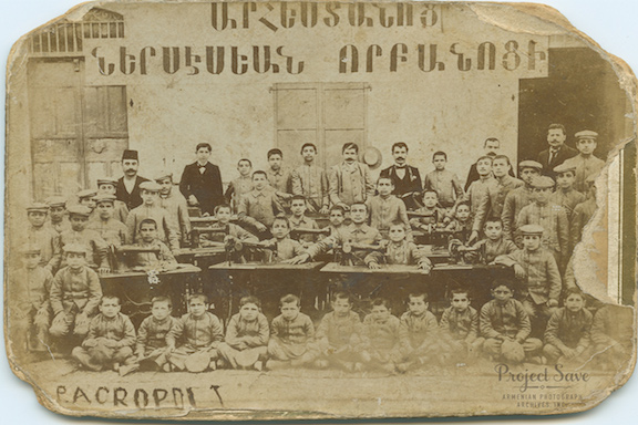 Students and teachers of the Nersessian Orphanage Trade School learn tailoring in 1902. (Source: Smithsonian)