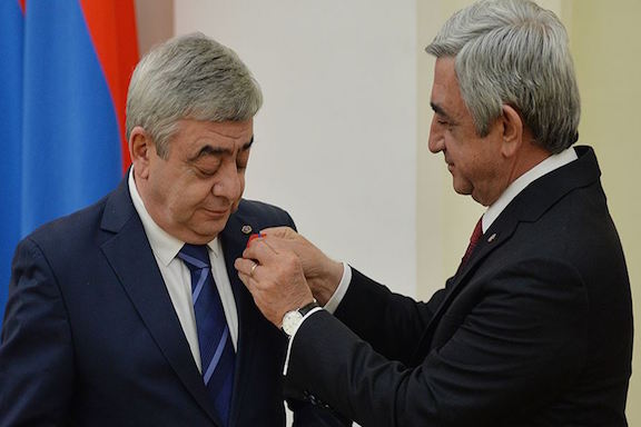 Former President Serzh Sarkisian awarding a medal to his brother, Levon Sarkisian, on March 22, 2016. (Source: Azatutyun.am)