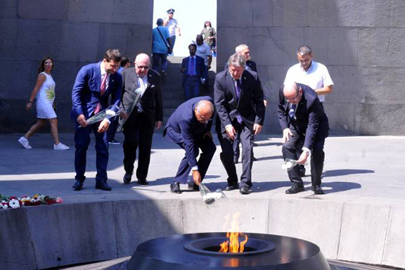 Israel’s Deputy Foreign Minister Alexander Ben-Zvi places a flower at the Dzidzernagapert Genocide Memorial on Tuesday