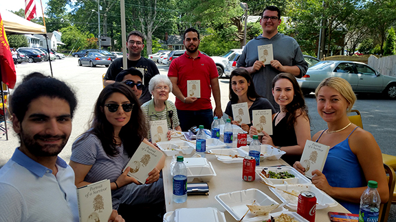 Richmond-native Rose Soghoian offers the ANCA Leo Sarkisian interns copies of “A Portrait of Survival,” penned by her sister, Florence, sharing her family’s story during the Armenian Genocide.