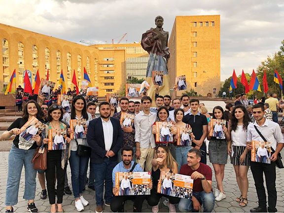 Young ARF campaigners in front of Yerevan's new Aram Manoukian statue