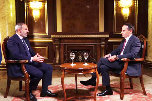 Prime Minister Nikol Pashinyan (left) during Friday's interview with Zinush