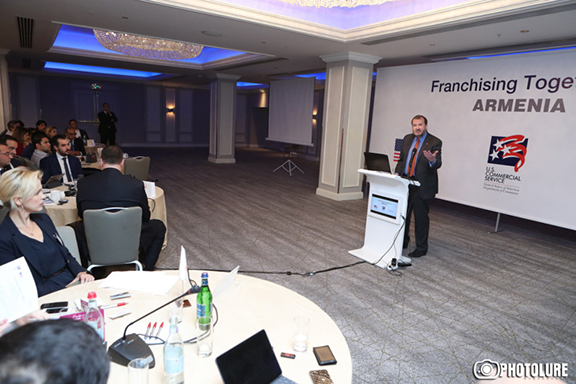 Ambassador Richard Mills makes a presentation at a franchise conference in Yerevan on Wednesday