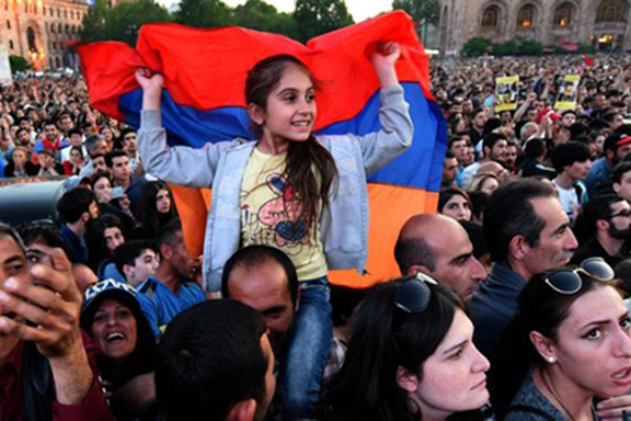 THE FUTURE OF ARMENIA: A young girl during one of the protests in Armenia last spring that toppled the govenment