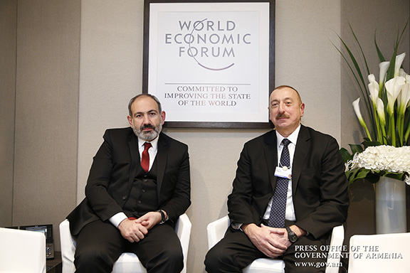 Prime Minister Nikol Pashnyan with Azerbaijani President Ilham Aliyev in Davos Switzerland on Jan. 22