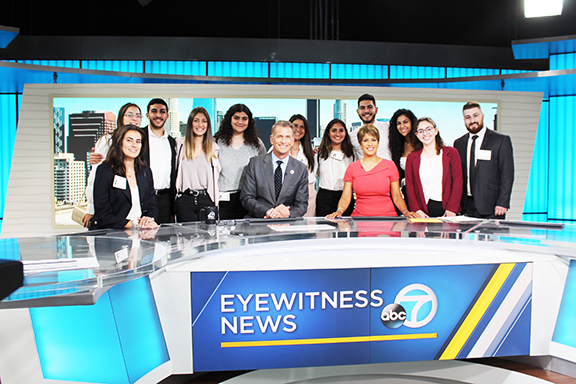A group of interns and past participants at the ABC7 Studios.