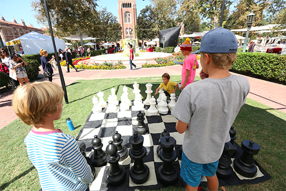 Children play chess during a past Innovate Armenia event