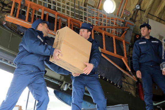 Armenian military personnel load a plane for a humanitarian mission to Syria on Feb. 8, 2019