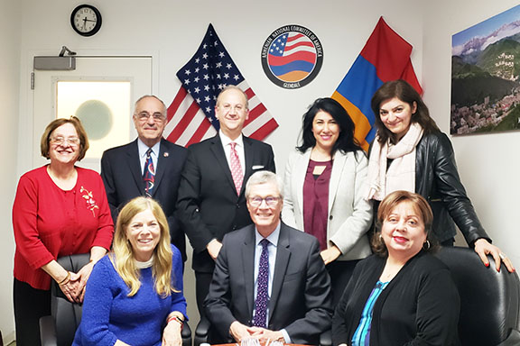 ANCA Glendale board members (standing) with GCC board members, seated from left Ann Ransford, Dr. David Viar, and Dr. Armine Hacopian
