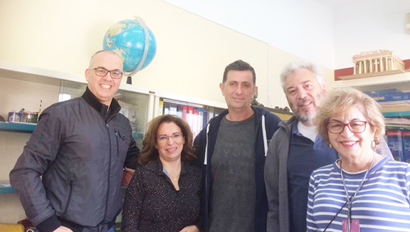 Teachers at the office Principal Ricardo Yerganian is behind the author.