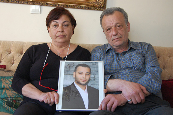 Ani and Garabet Balıkçı hold a photograph of their son Sevag (Photo: by Elsa Landard)