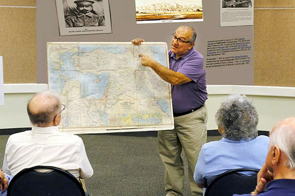 Deacon Van Der Mugrdechian displays a map showing the location of Van, Armenia