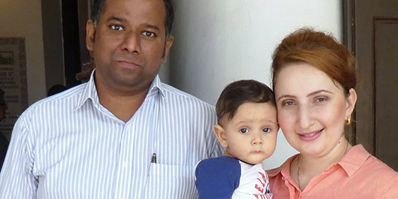 Baby Suren with his father Kapilan and mother Ashken. Image: Andrew Whitehead