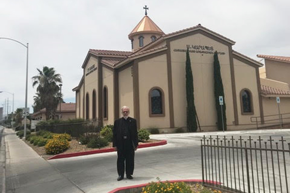 Archpriest Vahan Gosdanian in front of St. Garabed Church