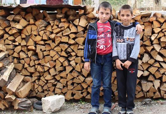 Armen Badalyan (left), who was injured by a mine-explosion outside his home in Norashen. Photo credit The Halo Trust