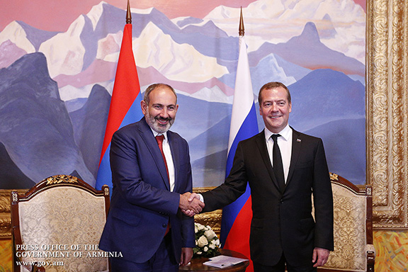 Russian Prime Minister Dmitry Medvedev (right) greets his counterpart from Armenia, Nikol Pashinyan in Kyrgystan