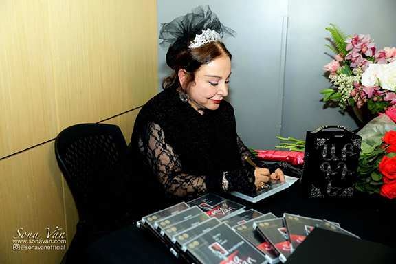 Sona Van signing copies of her audiobook