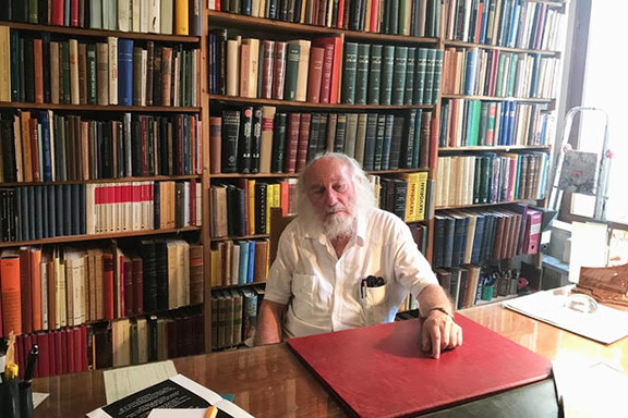 Claude Mutafian in his library