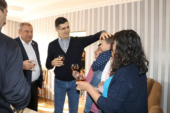 FCHA President Ashot Yeghiazaryan and VivaCell-MTS General Manager Ralph Yirikian visit the Meloyan family's new home