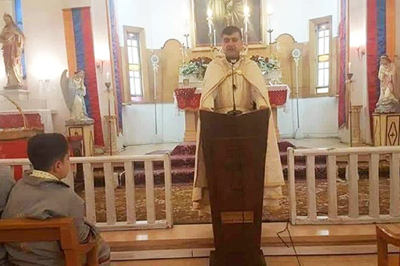 Father Hovsep Bedoyan, who was killed by Islamic State terrorists, at the altar of the St. Joseph's church in Qamishli, Syria