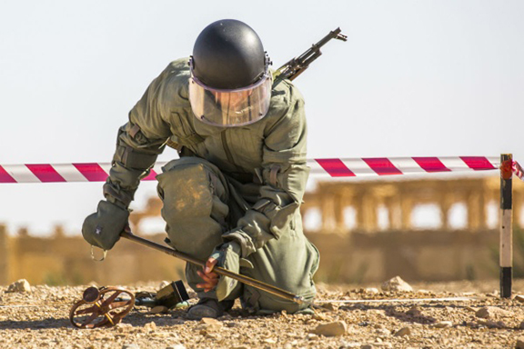 An Armenian sapper works in Syria