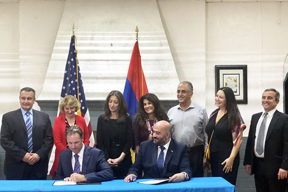 Founder of the Artsakh YMCA, Davit Melkumyan, joined representatives of the YMCA of Glendale for a ceremonial "Sister YMCA" relationship signing event