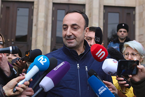 Head of Armenia's Constitutional Court Hrayr Tovmasyan talks to reporters