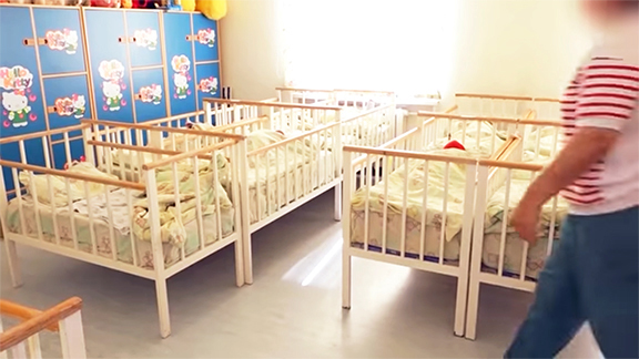 A screenshot of a video announcing the start of an investigation into an organized crime ring accused of selling babies, released by Armenia's National Security Service
