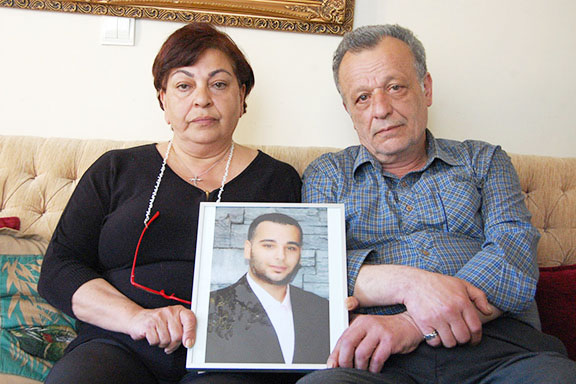 Ani and Garabet Balıkçı hold a photograph of their son Sevag (Photo: by Elsa Landard)