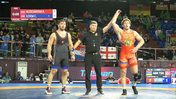 Artur Aleksanyan celebrates his win after defeating Cenk Ildem