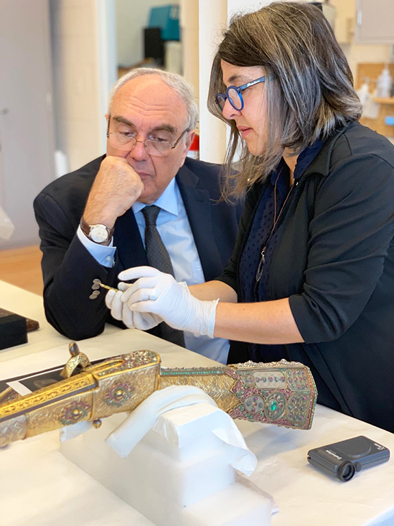 Dr. Chookaszian, the Chair of Armenian Art History and Theory at Yerevan State University (left) and Julie Lauffenburger, and Director of Conservation at the Walters Art Museum (right), amid inspections of the bejeweled gun