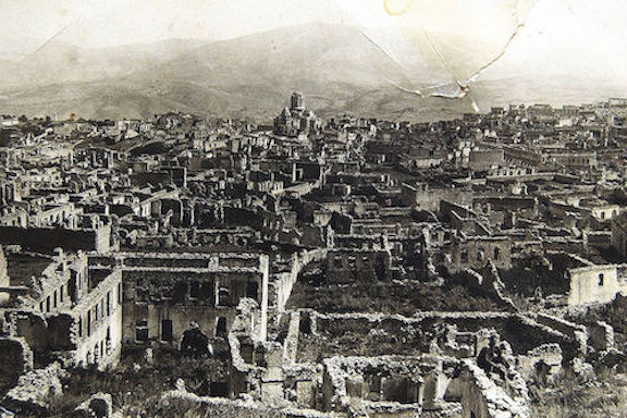 A ravaged Shushi after the Azerbaijani army destroyed the city on March 23, 1920. The Ghazantchetsots Cathedral is in the background
